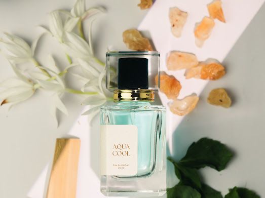 a bottle of perfume sitting on top of a table