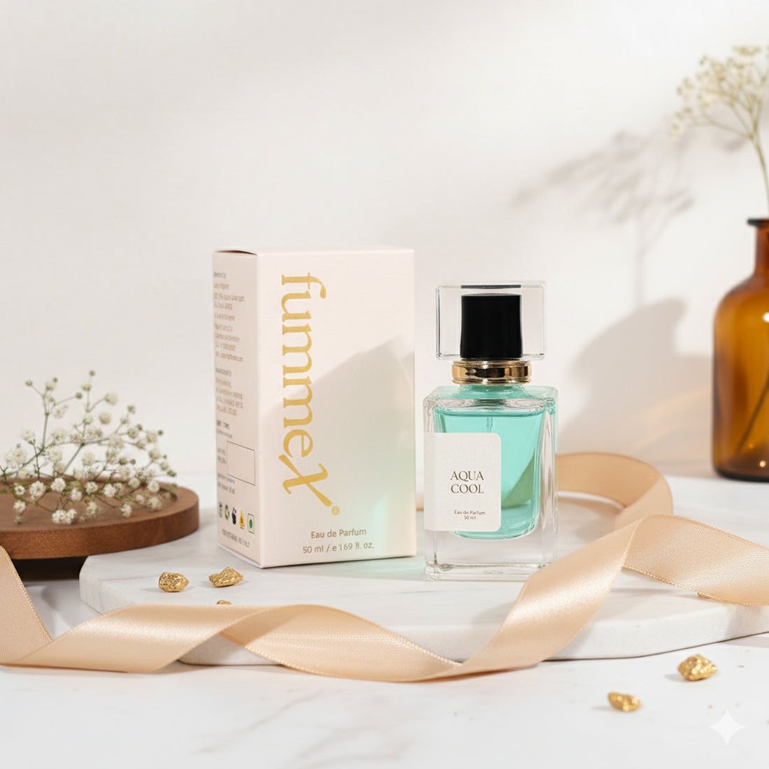 a bottle of perfume sitting next to a box