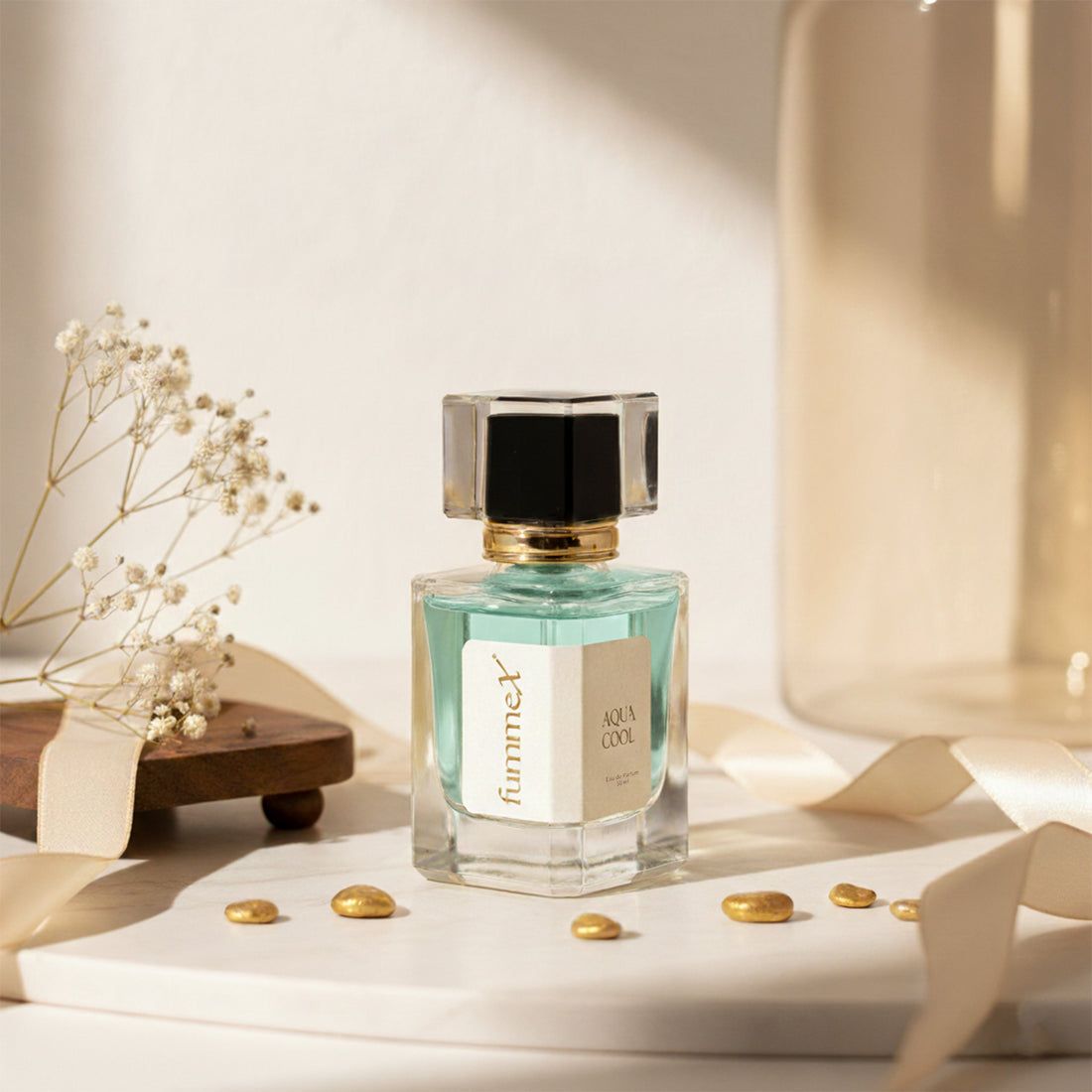 a bottle of perfume sitting on top of a table