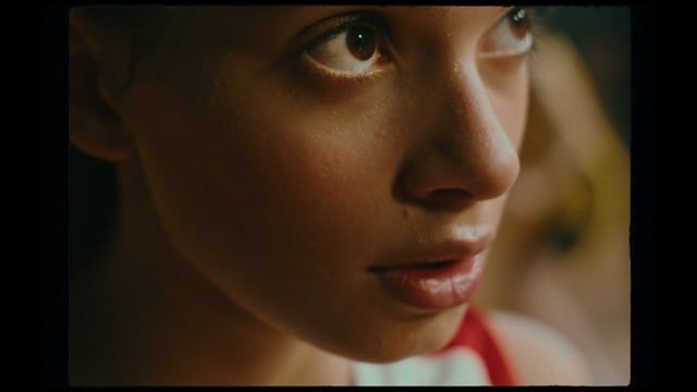 a close up of a woman's face with a blurry background