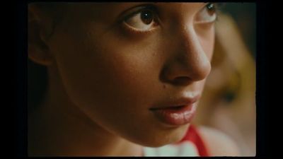 a close up of a woman's face with a blurry background