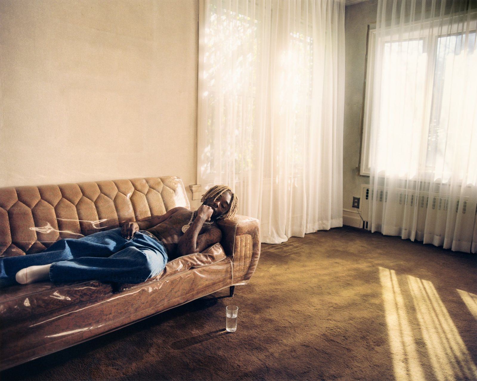 a person laying on a couch in a living room