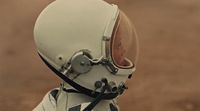 a close up of a person wearing a space suit