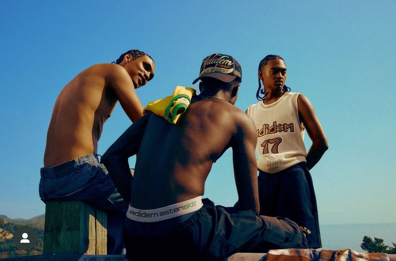 a group of young men sitting next to each other