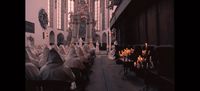 a large group of people sitting in a church