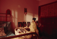 a woman sitting in a chair in a room