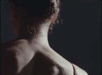 the back of a woman's body is shown in black and white