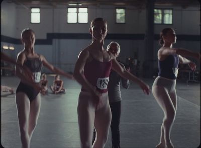 a group of women standing next to each other in a gym