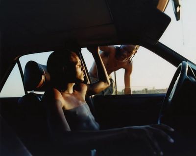 a couple of people that are in a car