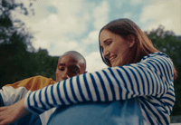 a man and a woman sitting next to each other