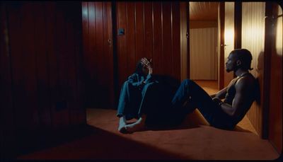 a man sitting on the floor in a room