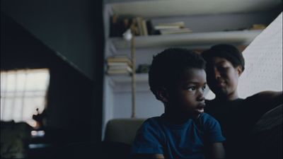 a man and a young boy sitting on a couch