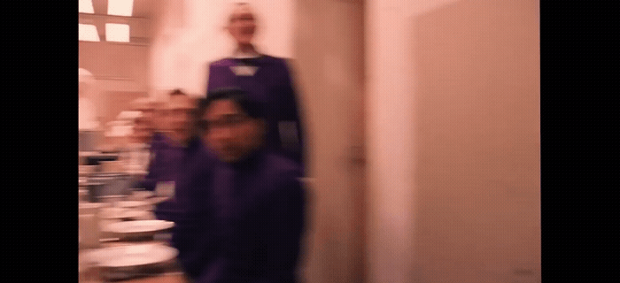 a blurry photo of two people in a room