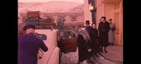 a group of people standing around a white truck