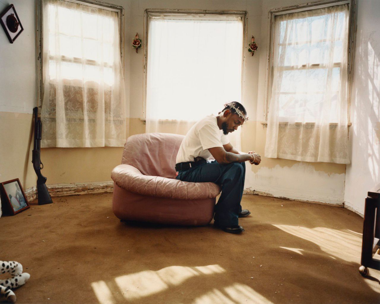 a man sitting on a chair in a living room