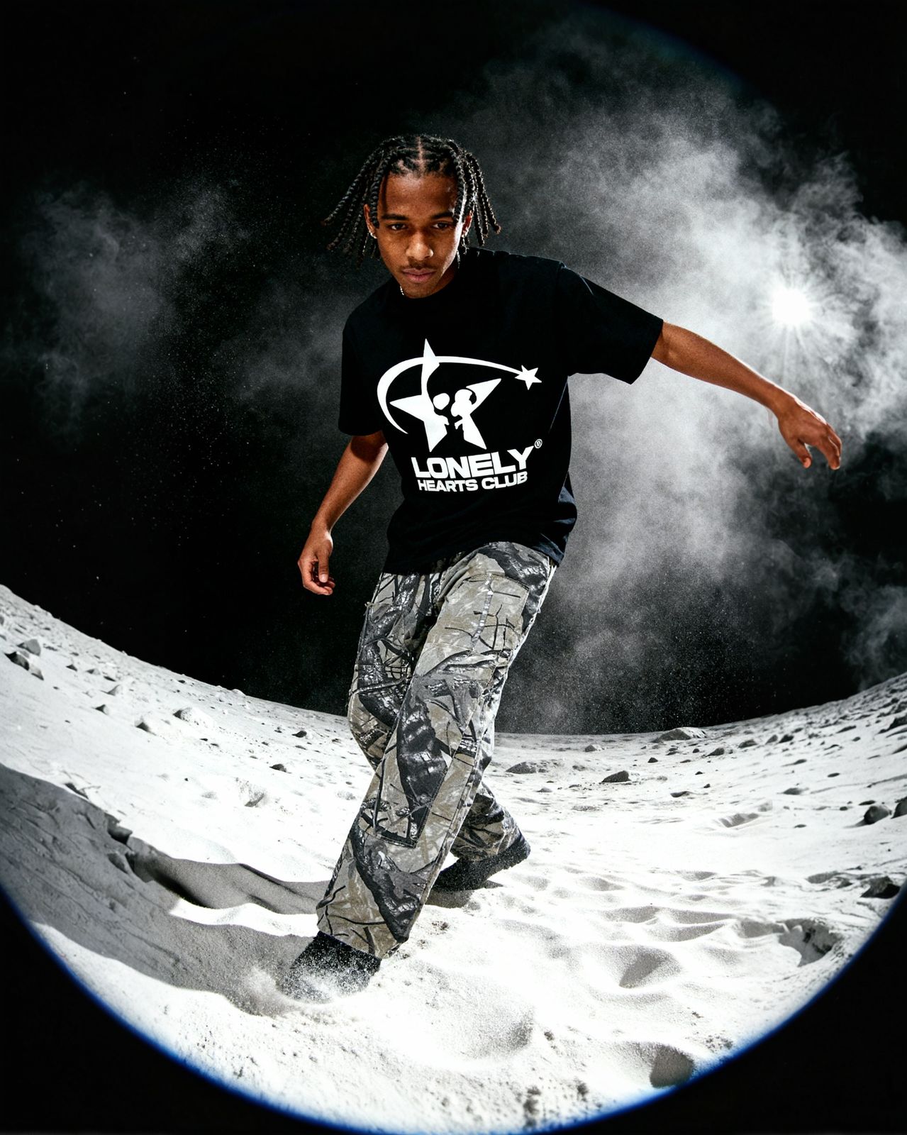 a man riding a snowboard down a snow covered slope