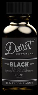 a bottle of black beard oil on a black background