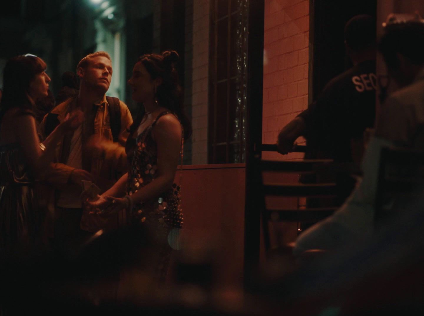 a group of people sitting at a table talking