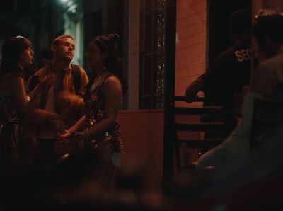 a group of people sitting at a table talking