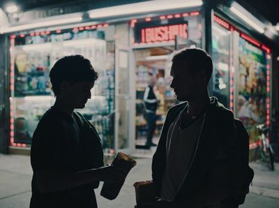 a couple of men standing next to each other