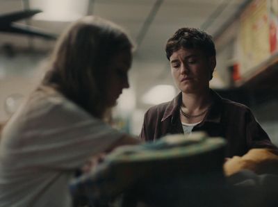 a woman standing next to a man in a store