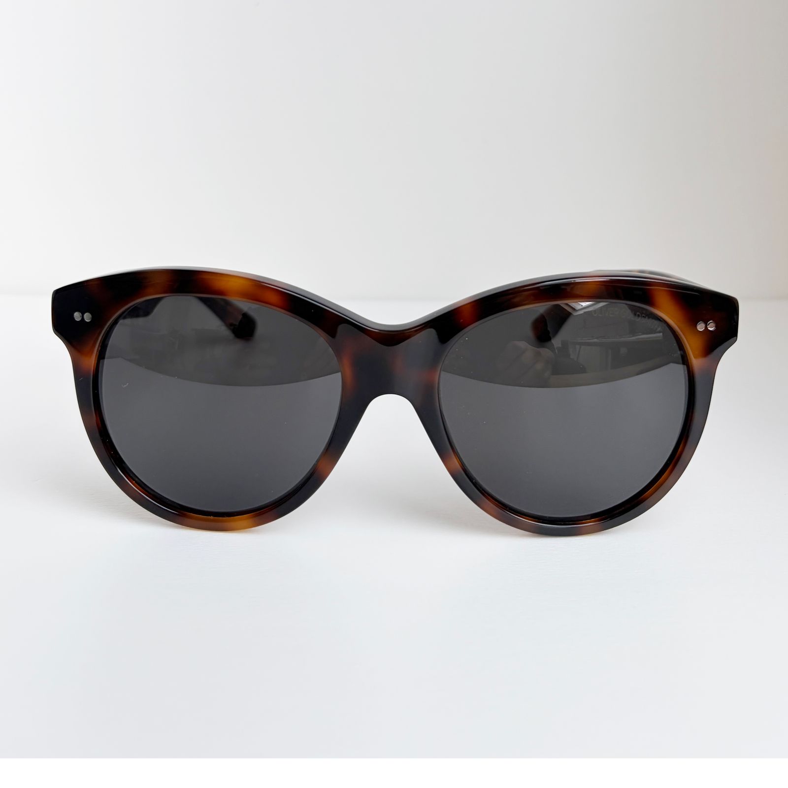 a pair of sunglasses sitting on top of a table