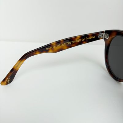 a pair of sunglasses sitting on top of a table