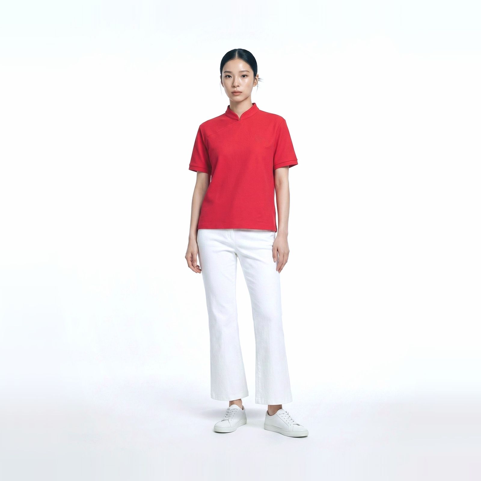 a woman in a red shirt and white pants