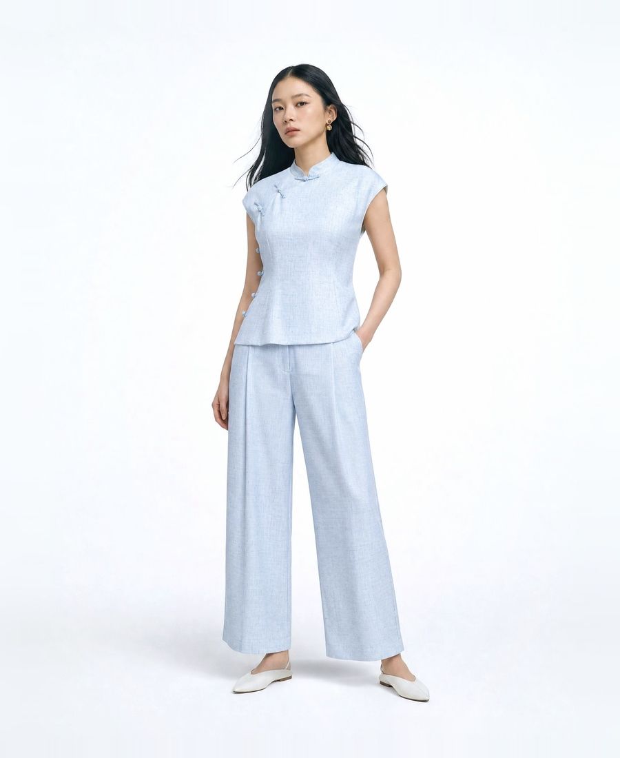 a woman in a blue top and pants