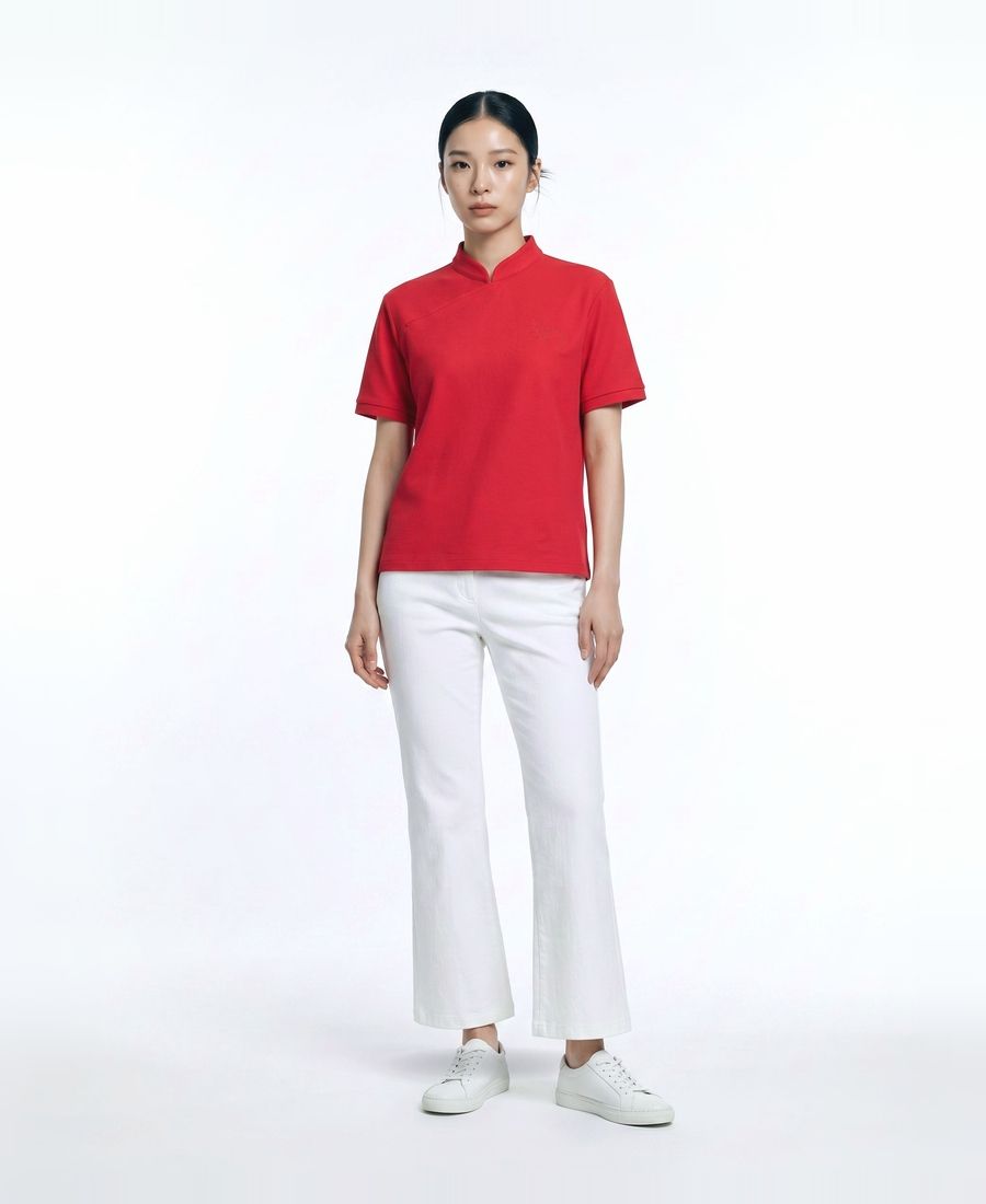 a woman in a red shirt and white pants