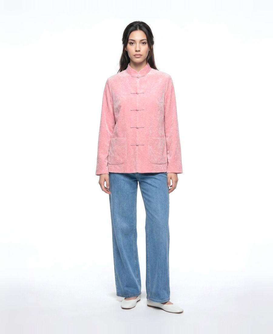 a woman standing in front of a white background
