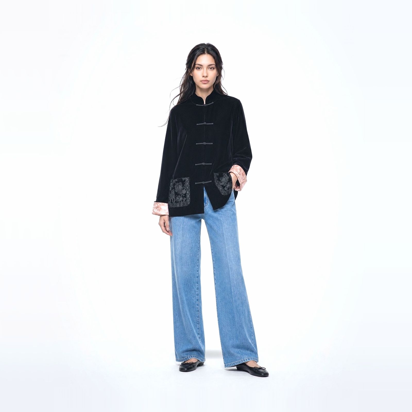 a woman in a black jacket and jeans