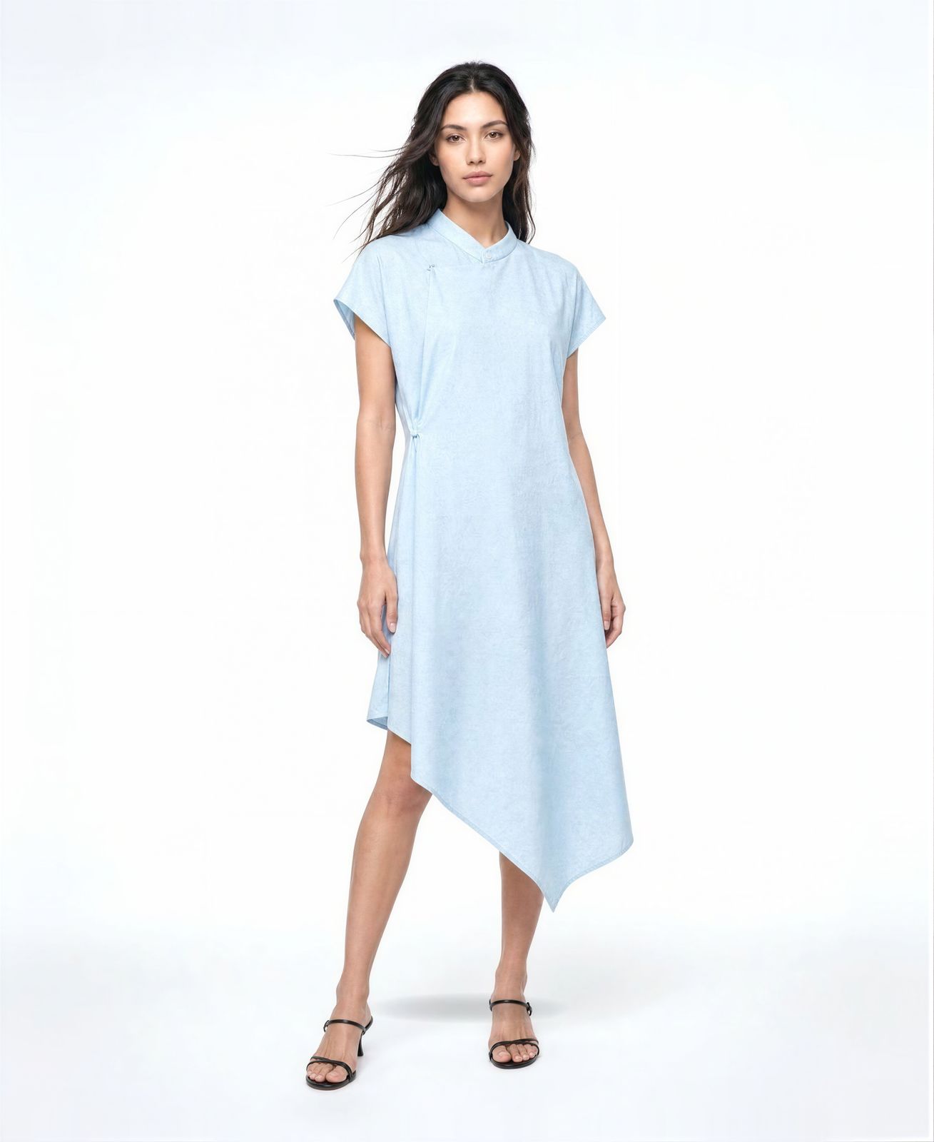a woman is wearing a blue dress and sandals
