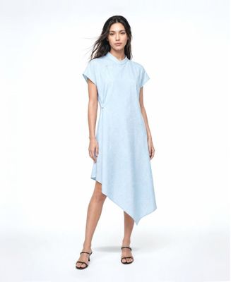 a woman is wearing a blue dress and sandals