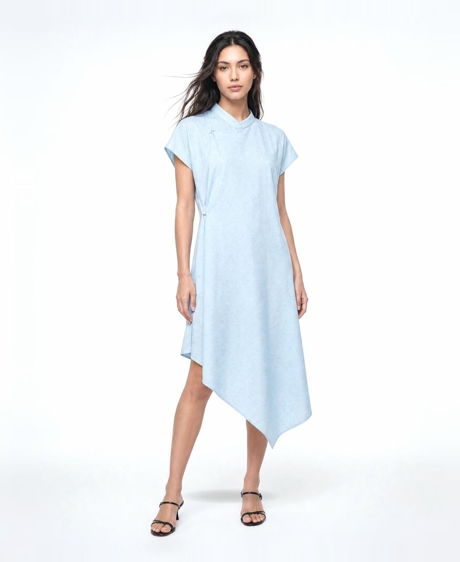a woman wearing a blue dress and sandals