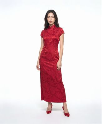 a woman wearing a red dress and red shoes