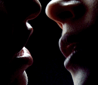 a close up of a person kissing another person