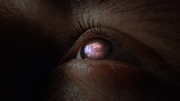 a close up of a person's eye with a blurry background