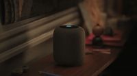 a smart speaker sitting on top of a wooden table