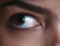 a close up of a person's blue eyes