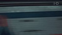 a blurry image of a person walking on a train track