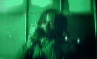 a blurry photo of a person holding a cell phone