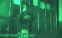 a blurry image of a person holding a cell phone