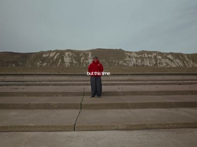 a man standing in front of some steps