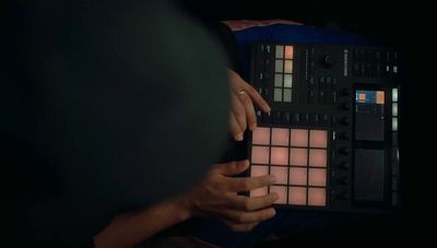 a close up of a person holding a control panel