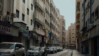 a row of parked cars on a city street