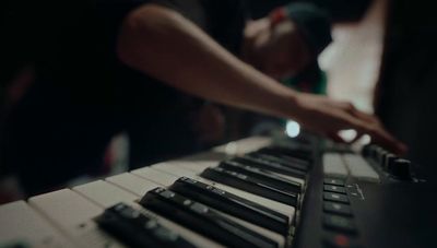 a close up of a person playing a keyboard