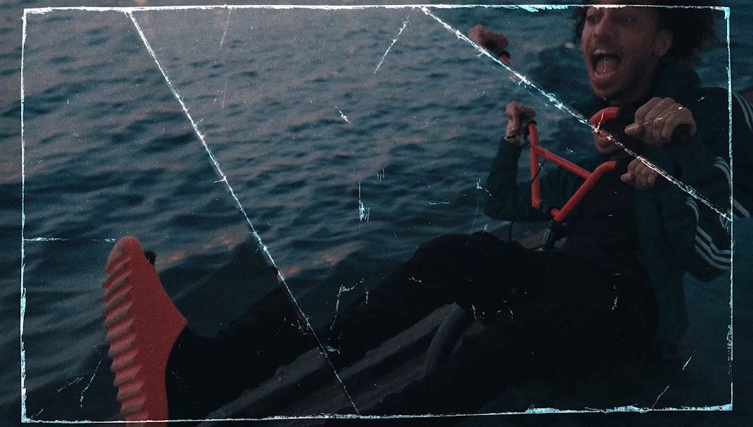 a man riding a boat on top of a body of water