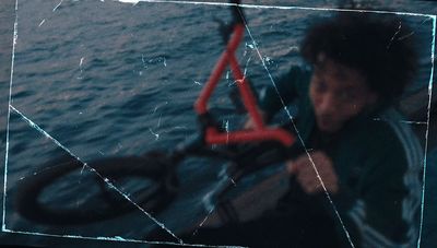 a man sitting on a boat in the water