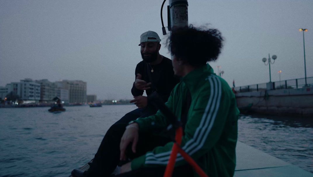 a couple of people sitting on top of a boat